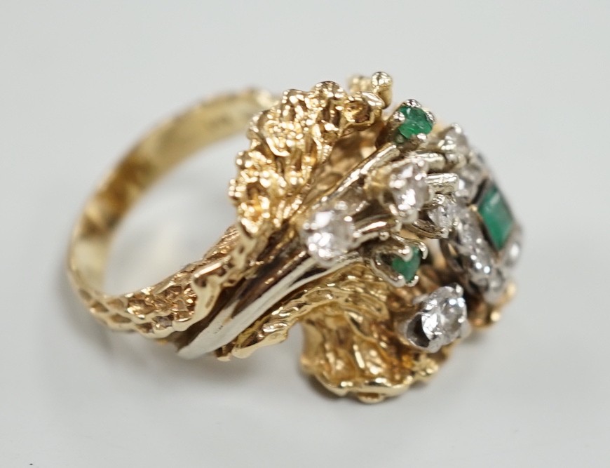 A modern 14k, emerald and diamond cluster set modernist dress ring, size L, gross weight 13.4 grams.